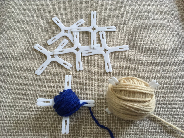Several yarn bobbins, some with yarn wound onto them
